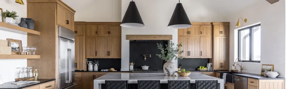 photo of Industrial Chic black, matte conical pendant lighting in a modern farm house style kitchen
